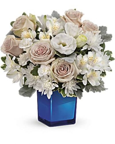 <div id="mark-3" class="m-pdp-tabs-marketing-description">Bursting with gorgeous roses and blooms, this cobalt or clear glass cube vase is a gorgeous gift that can also serve as a beautiful candleholder!</div>
&nbsp;
<div id="desc-3">This splendid bouquet features crème roses, white cushion spray chrysanthemums, white lisianthus, white alstroemeria, miniature white carnations, dusty miller and variegated pittosporum.
<ul>
 	<li>Our florists hand-design each arrangement, so colors, varieties and containers may vary due to local availability</li>
</ul>
</div>