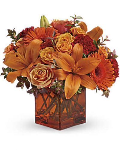 <div id="mark-3" class="m-pdp-tabs-marketing-description">Celebrate the wonder of a new day with warm, golden flowers. A modern orange glass vase is the foundation of this stunning, sun-bright bouquet that energizes any occasion</div>
<ul>
 	<li>Orange gerbera daisies, orange roses and red mini carnations are accented with a spray of red huckleberry in a cube vase</li>
 	<li>Our florists hand-design each arrangement, so colors, varieties and containers may vary due to local availability</li>
</ul>
<div id="desc-3"></div>
&nbsp;

&nbsp;

&nbsp;
