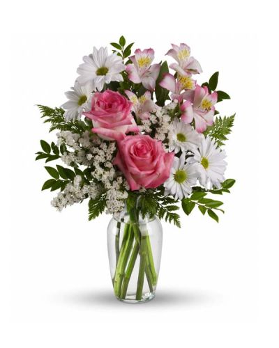 This lovely bouquet of pink roses, pink alstroemeria and white mums in a sparkling clear glass vase is an endearing way to Treat Your Sweet. It is an inspired choice for brightening a birthday, anniversary, special occasion or just because.
<ul>
 	<li>Our florists hand-design each arrangement, so colors, varieties and containers may vary due to local availability</li>
</ul>