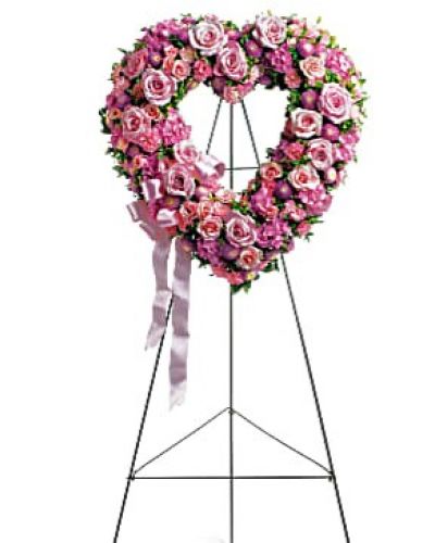 <div id="mark-1" class="m-pdp-tabs-marketing-description">In the shape of a heart, and accented with a pink satin ribbon, this garden of delicate blooms is a tender and classic tribute to a precious life, and a cherished expression of love and sympathy.</div>
<div id="desc-1">
<ul>
 	<li>Beautiful flowers such as light pink roses, hydrangea and miniature carnations mix with lavender chrysanthemums on an open heart-shaped wreath.</li>
 	<li>Our florists hand-design each arrangement, so colors, varieties and containers may vary due to local availability</li>
</ul>
</div>