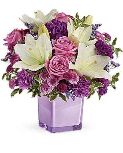 <div class="m-pdp-tabs-description">
<div id="mark-3" class="m-pdp-tabs-marketing-description">These luxurious lavender roses and crisp white lilies are poised to please! Perfectly presented in a stylish cube vase, it's an any-occasion surprise they'll never forget!</div>
</div>
Lavender roses, white asiatic lilies, purple carnations, lavender carnations, purple button spray chrysanthemums and lavender button spray chrysanthemums are arranged with lavender limonium and pitta negra. Delivered in a glass cube.
<ul>
 	<li>Our florists hand-design each arrangement, so colors, varieties and containers may vary due to local availability</li>
</ul>
