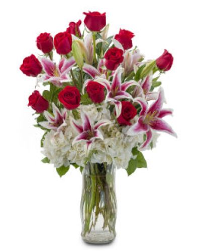 Deliver inspiration to your special someone with this classically gorgeous arrangement of a dozen red roses accented with lilies and hydrangea.
<ul>
 	<li>Our florists hand-design each arrangement, so colors, varieties and containers may vary due to local availability</li>
</ul>